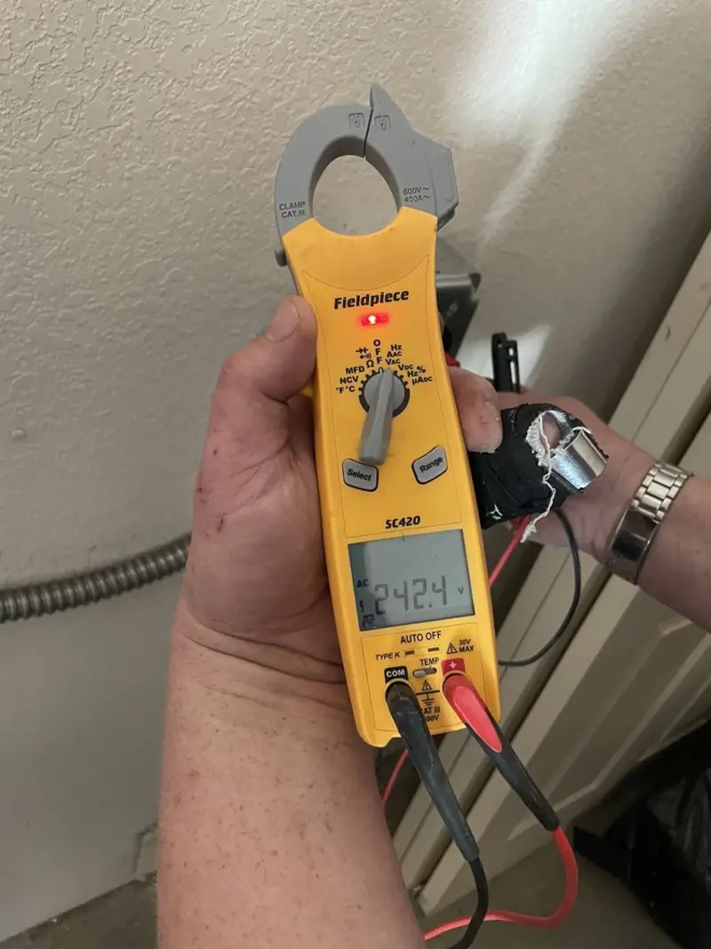 Voltage testing with clamp meter during Recessed Lighting Installation in Oceanport